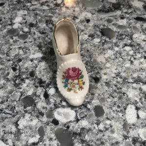 Vintage porcelain miniature collectible shoe from approximately 1920s